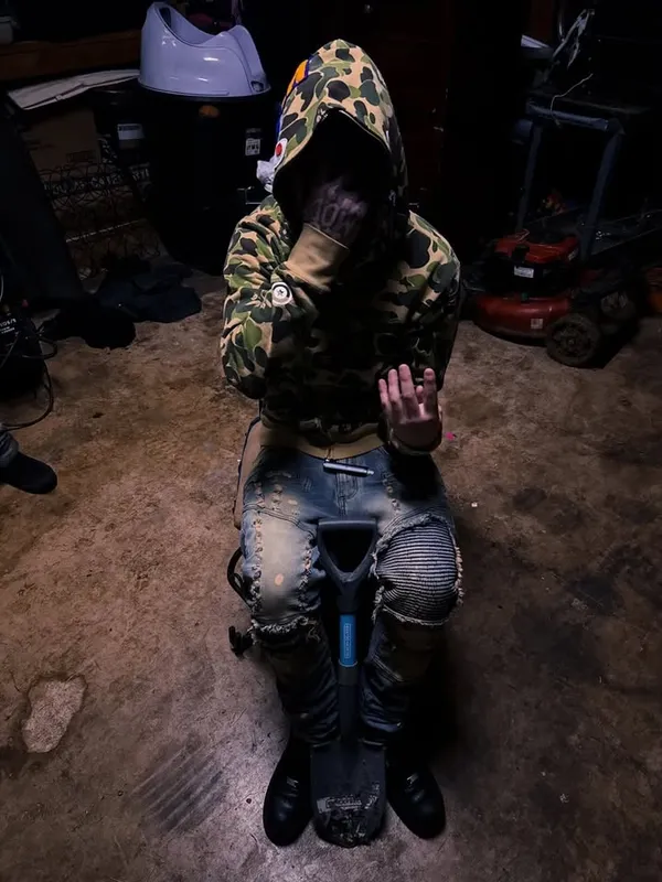 Camo hood, hand up