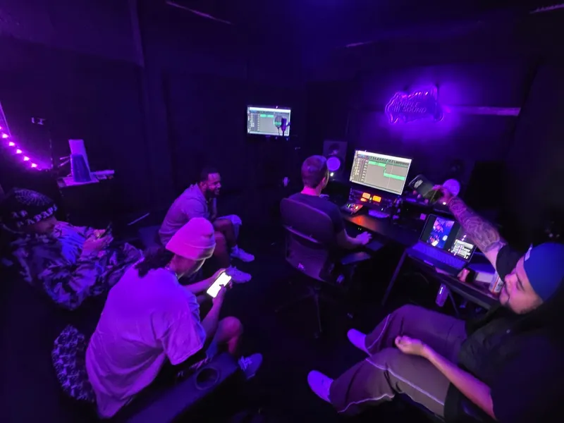 Half five — at the desk, the neon up