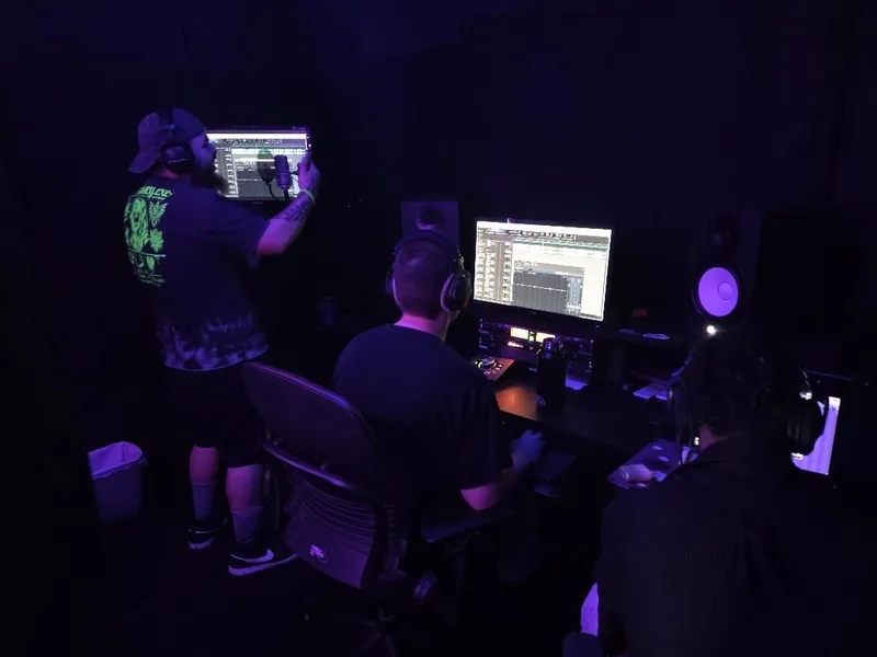 Punching in at the booth wall, the session up on every screen in the room