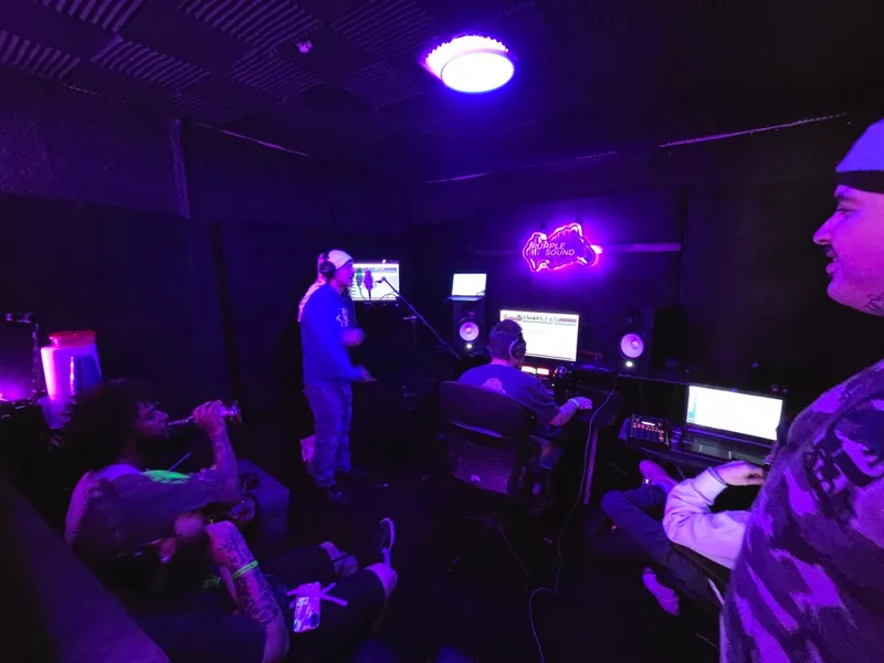 Standing at the back of the room