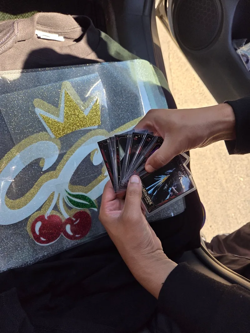 The calling cards fanned out on the seat