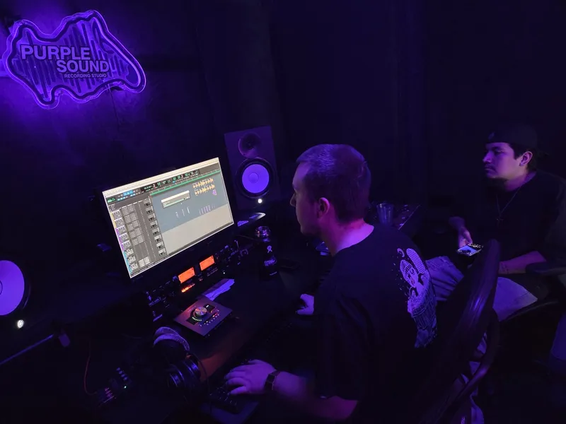 Under the neon at the desk